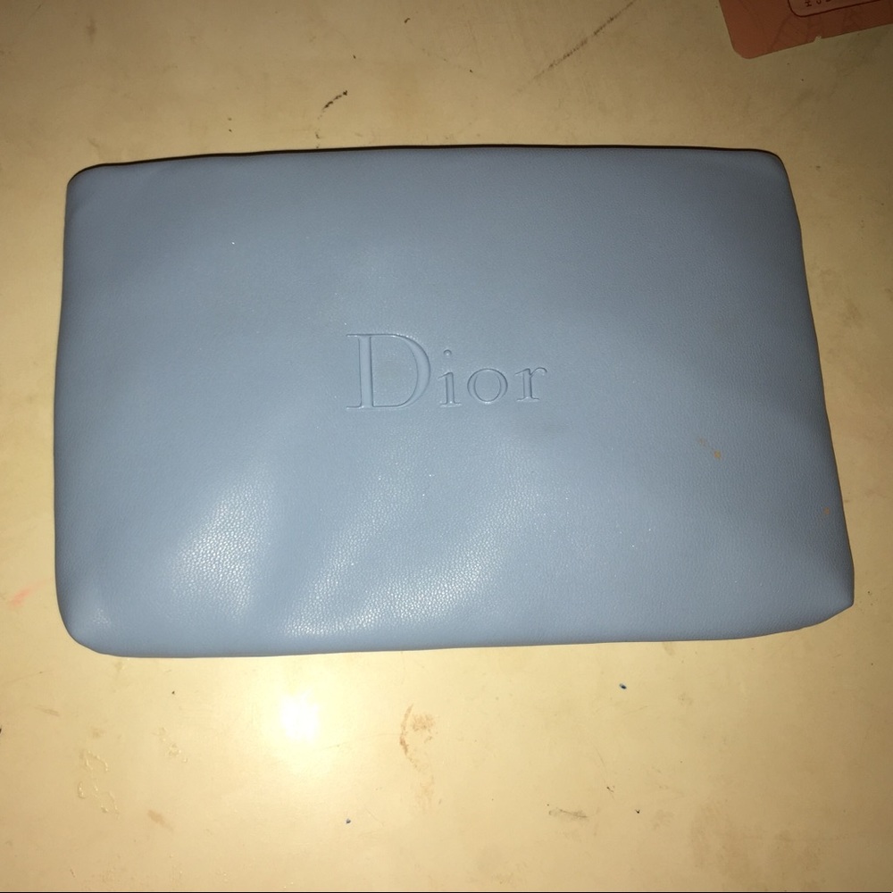 Small Dior makeup bag.